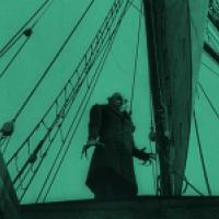 Nosferatu the vampire appears to be standing on a ship.