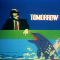 A television animation featuring a man in a suit, a dolphin and the word "TOMORROW".
