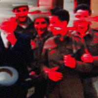 An image of a group of men posing together, arm-in-arm. Their faces and hands are obscured by vibrant red scratches.